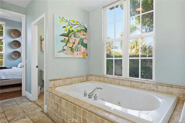 a bedroom with a bed and a table