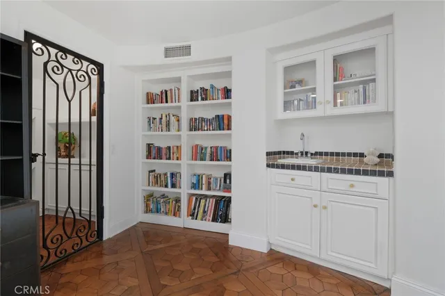 a workspace with furniture a fireplace and a window