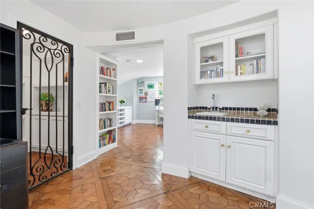 a view of an outdoor dining space with a table and chairs