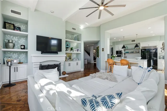 a living room with fireplace furniture and a flat screen tv