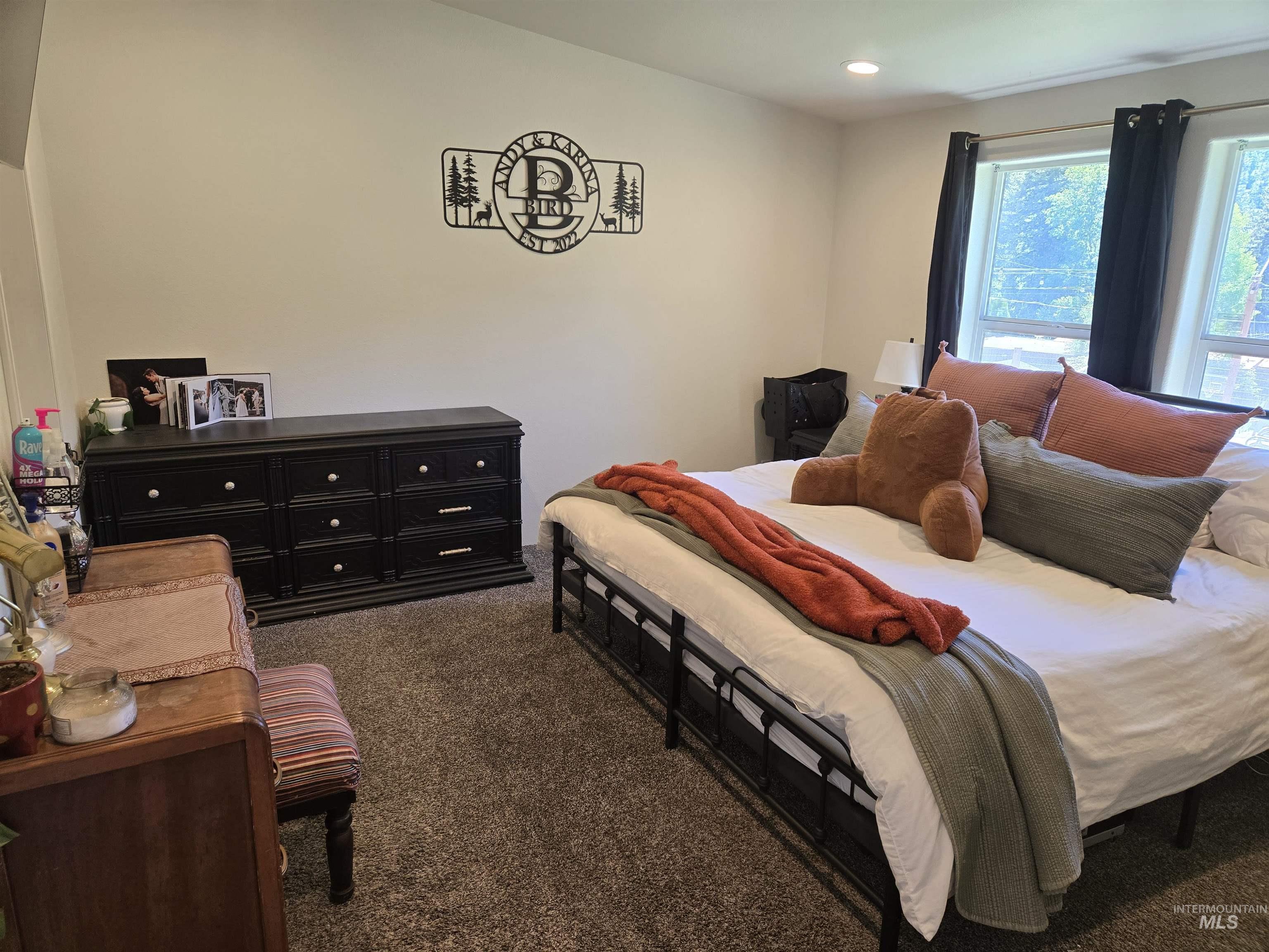 174 Konkolville Road Orofino, ID 83544 - Photo 17 of 43 Bedroom featuring two windows, neutral wall tones, recessed lighting, and carpet flooring