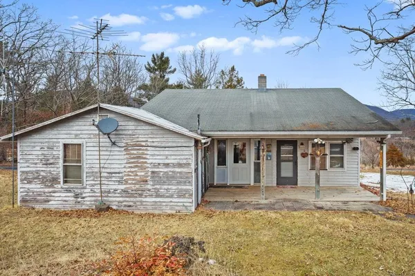 a view of a town with mountains in the background