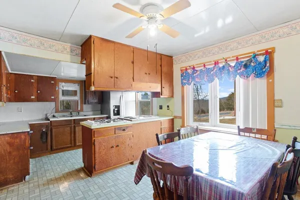 a view of outdoor space with trees in the background