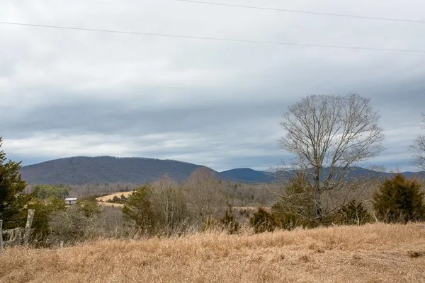 a front view of house with yard covered in snow