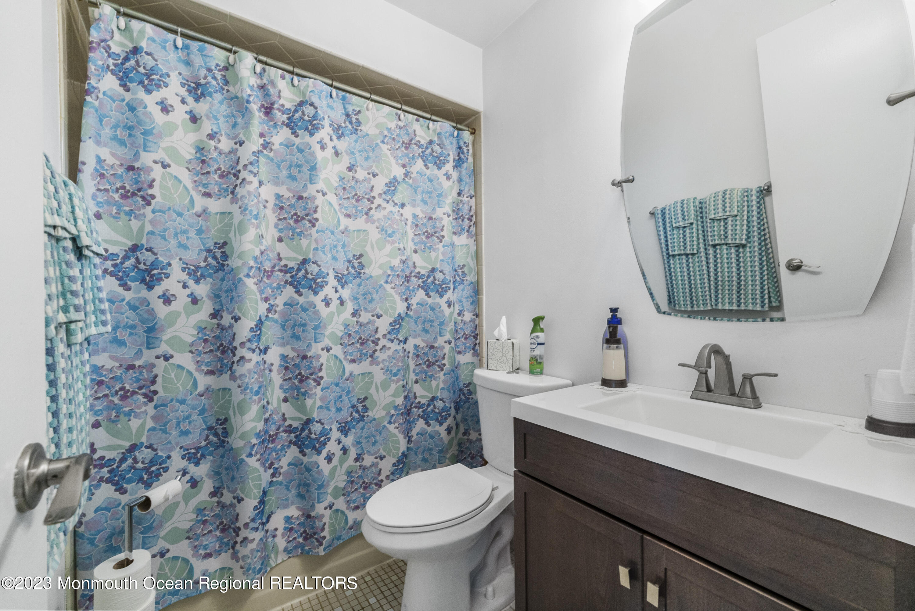 186 Tulip Lane Freehold, NJ 07728 - Photo 11 of 18 a bathroom with a sink toilet and mirror