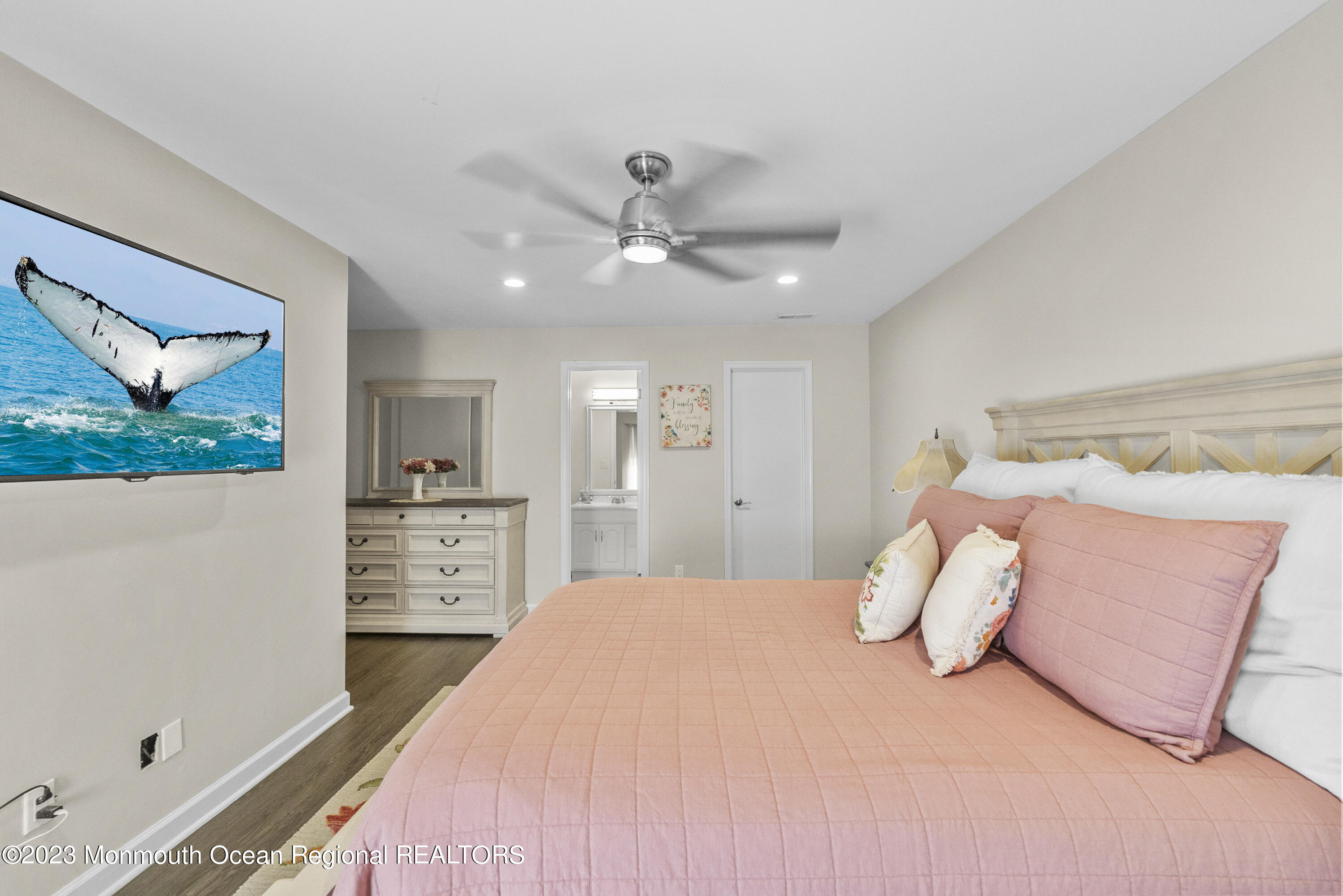 186 Tulip Lane Freehold, NJ 07728 - Photo 14 of 18 a bedroom with a large bed and a chandelier