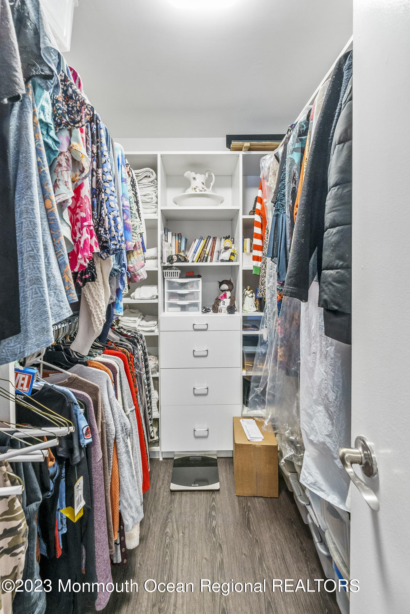 186 Tulip Lane Freehold, NJ 07728 - Photo 16 of 18 a view of walk in closet with clothes and shoes