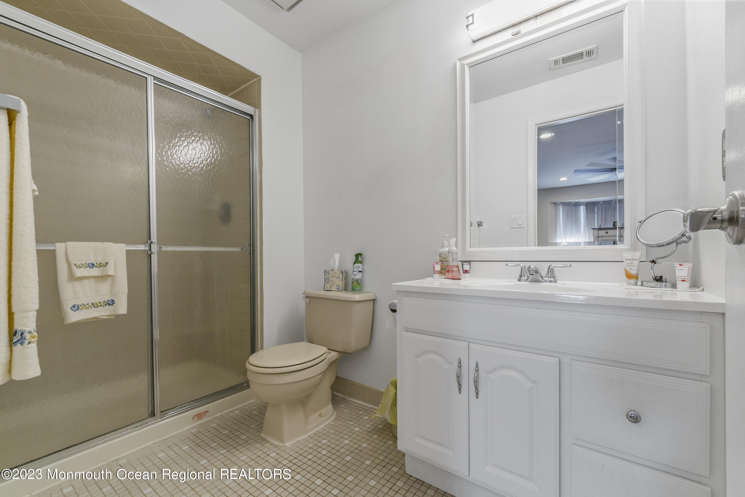 186 Tulip Lane Freehold, NJ 07728 - Photo 17 of 18 a bathroom with a sink toilet and shower