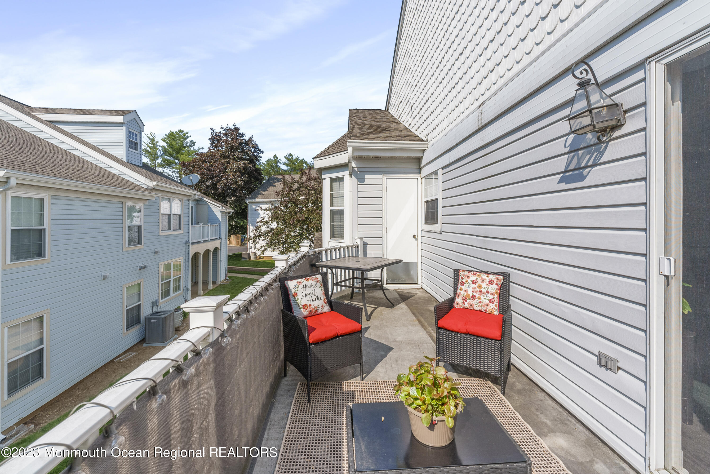 186 Tulip Lane Freehold, NJ 07728 - Photo 18 of 18 a view of a chairs and table in the balcony