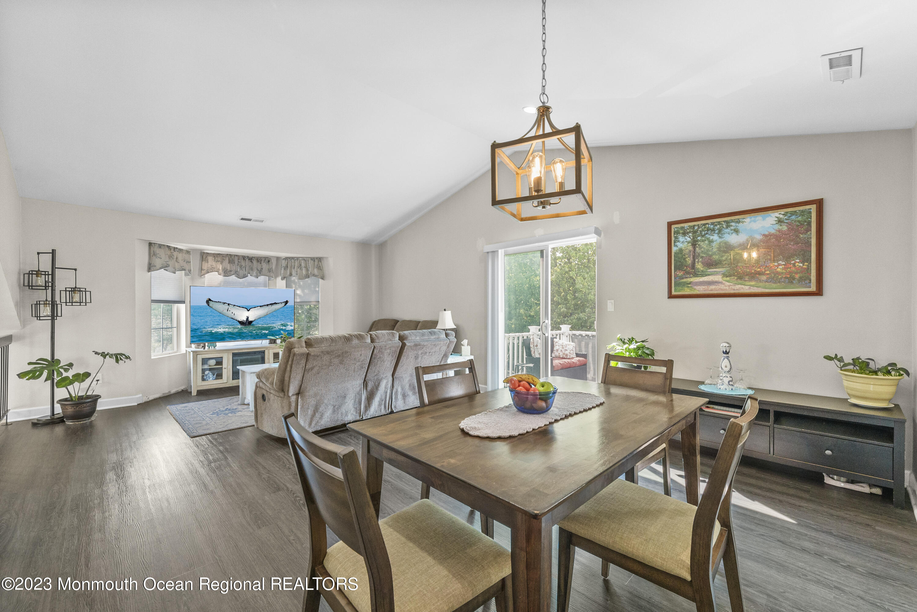 186 Tulip Lane Freehold, NJ 07728 - Photo 6 of 18 a view of a dining room with furniture large window and wooden floor