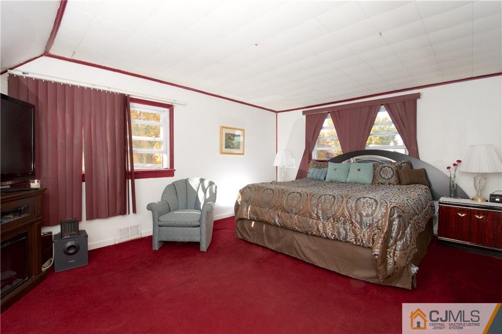 71 South Pennington Road New Brunswick, NJ 08901 - Photo 14 of 24 a bedroom with a bed chair and window