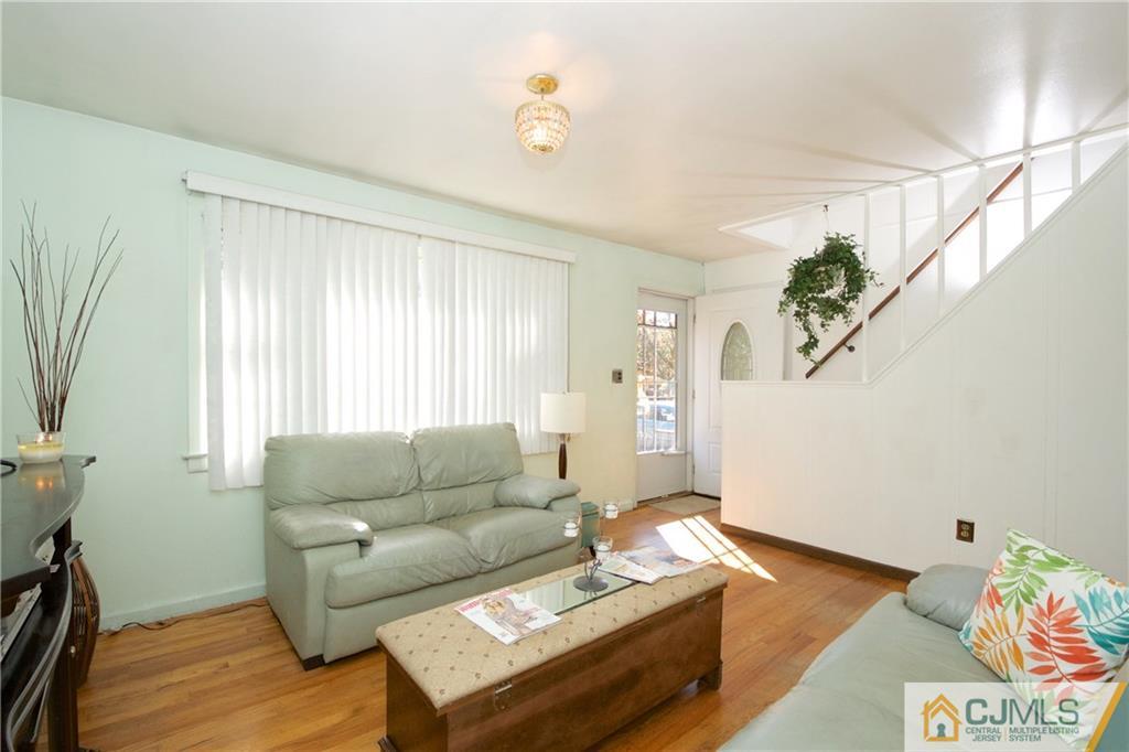 71 South Pennington Road New Brunswick, NJ 08901 - Photo 3 of 24 a living room with furniture and a window