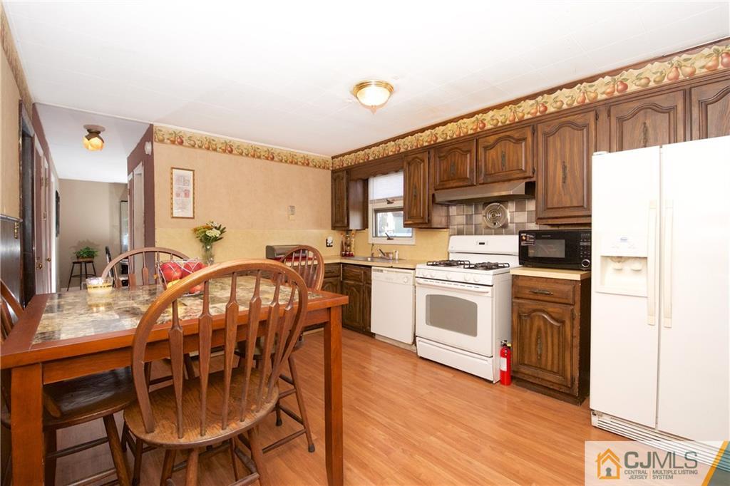 71 South Pennington Road New Brunswick, NJ 08901 - Photo 6 of 24 a kitchen with stainless steel appliances a stove a sink dishwasher and a refrigerator