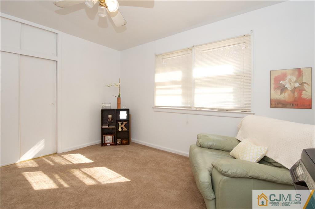 71 South Pennington Road New Brunswick, NJ 08901 - Photo 9 of 24 a living room with furniture and a window