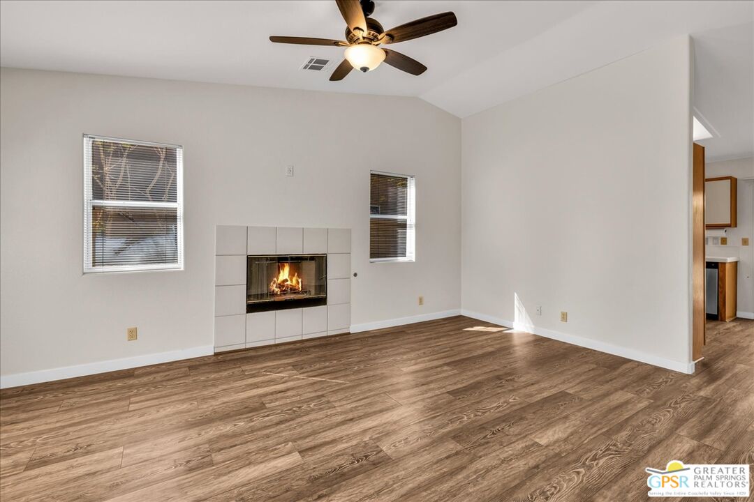 68130 Hermosillo Road Cathedral City, CA 92234 - Photo 12 of 49 a view of an empty room with window and wooden floor