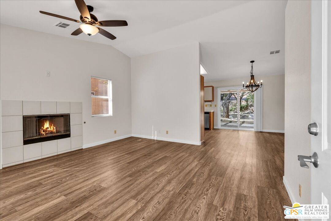 68130 Hermosillo Road Cathedral City, CA 92234 - Photo 13 of 49 wooden floor in an empty room with a window