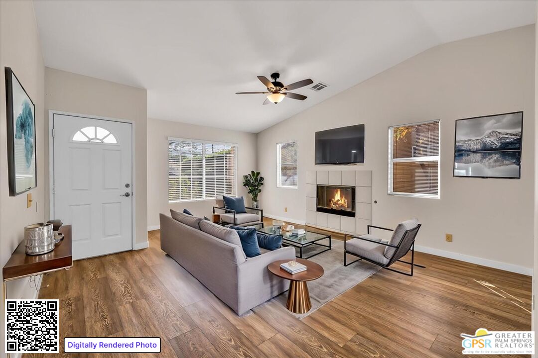 68130 Hermosillo Road Cathedral City, CA 92234 - Photo 2 of 49 a living room with furniture a fireplace and a flat screen tv