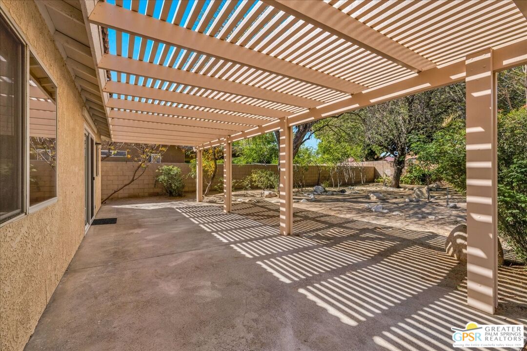 68130 Hermosillo Road Cathedral City, CA 92234 - Photo 35 of 49 a view of a patio with table and chairs and wooden floor