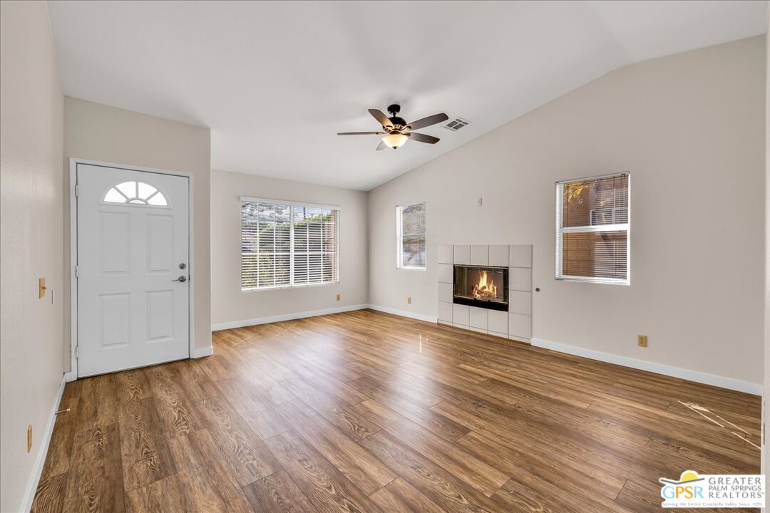 68130 Hermosillo Road Cathedral City, CA 92234 - Photo 10 of 49 a view of empty room with wooden floor and fan