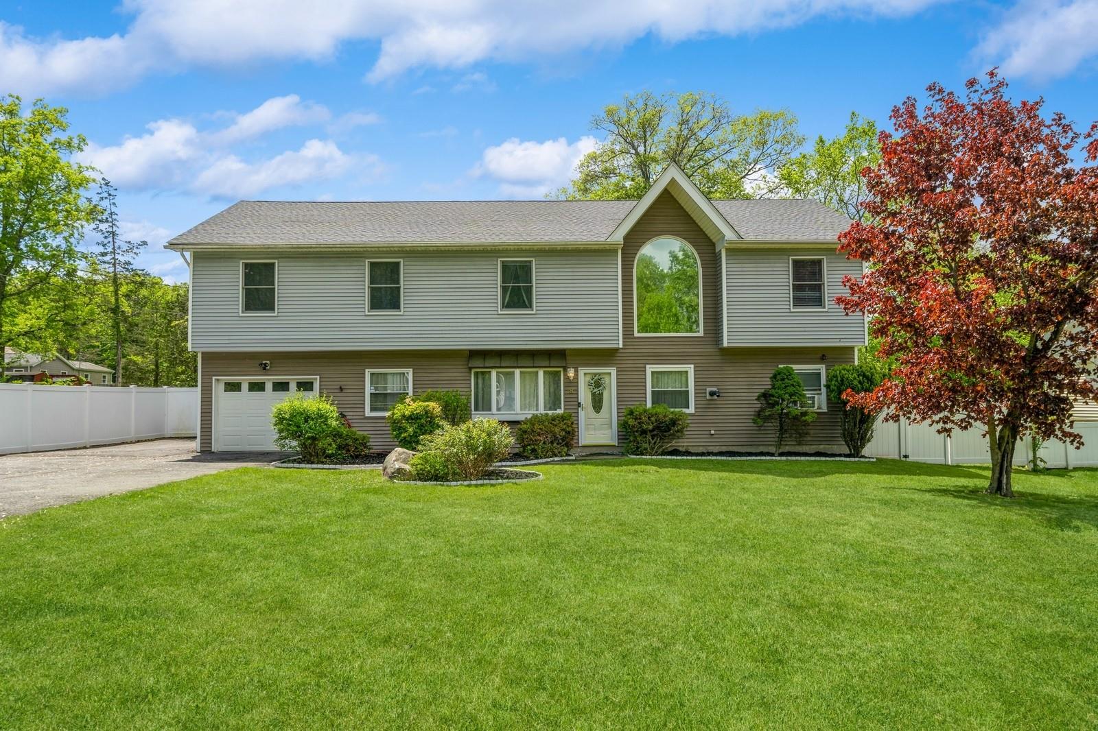 8 Ludwig Drive Monroe, NY 10950 - Photo 1 of 1 View of front of home featuring asphalt driveway, a garage, and roof with shingles