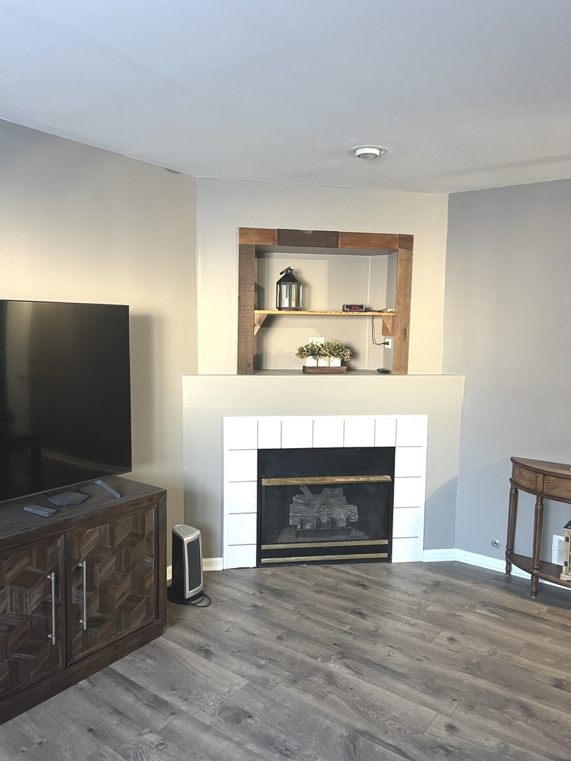 2233 Dawson Lane Algonquin, IL 60102 - Photo 28 of 52 a living room with furniture and a fireplace