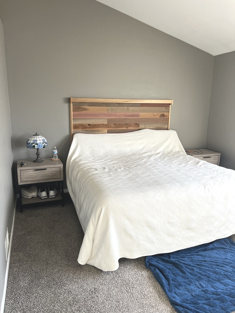 2233 Dawson Lane Algonquin, IL 60102 - Photo 32 of 52 a bedroom with a bed and a night stand