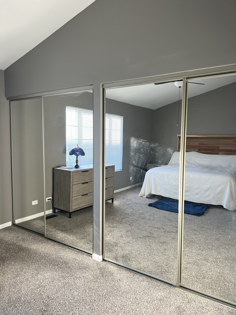 2233 Dawson Lane Algonquin, IL 60102 - Photo 35 of 52 a bedroom with a bed and a glass door shower