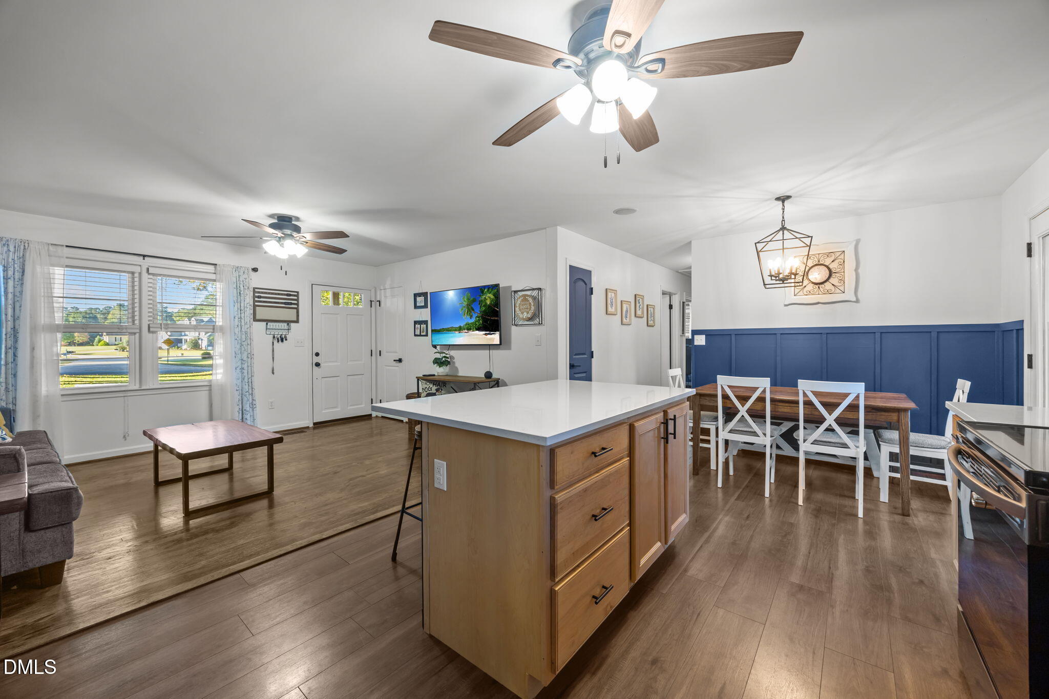Generous kitchen island w/ quartz counters.