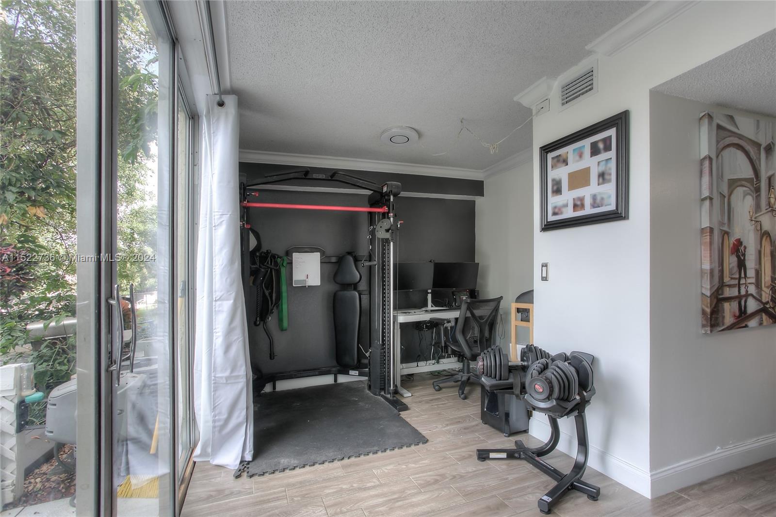 8401 West Sample Road, Unit 35 Coral Springs, FL 33065 - Photo 11 of 13 a view of a room with gym equipment