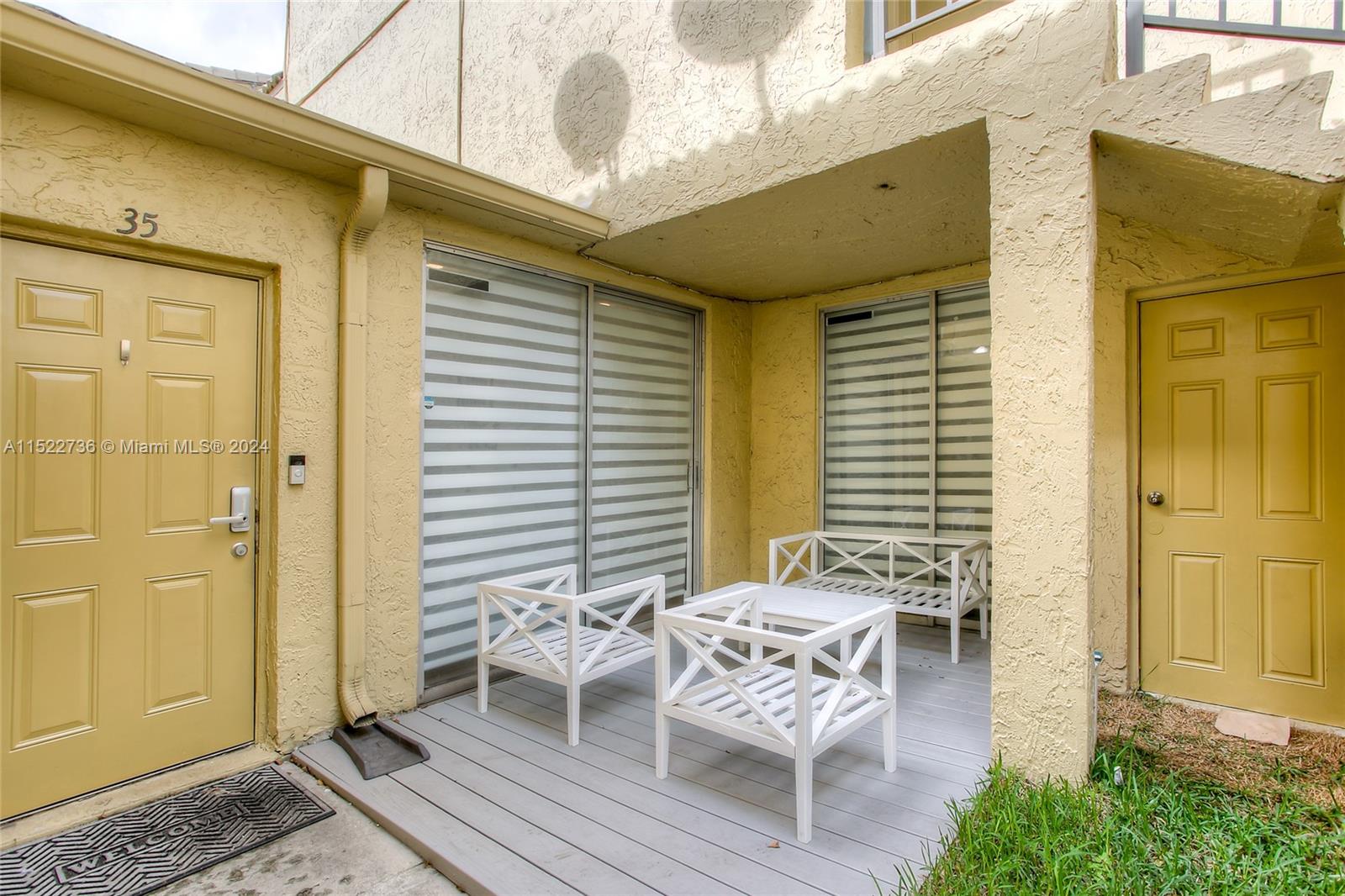 8401 West Sample Road, Unit 35 Coral Springs, FL 33065 - Photo 13 of 13 an outdoor view with patio
