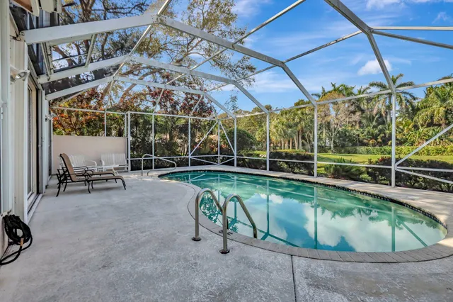 a view of a swimming pool with a patio