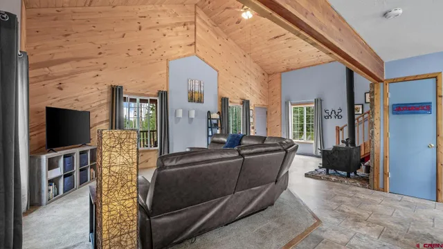 a kitchen with furniture a counter top space and stainless steel appliances