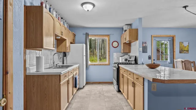 a stove top oven sitting inside of a kitchen