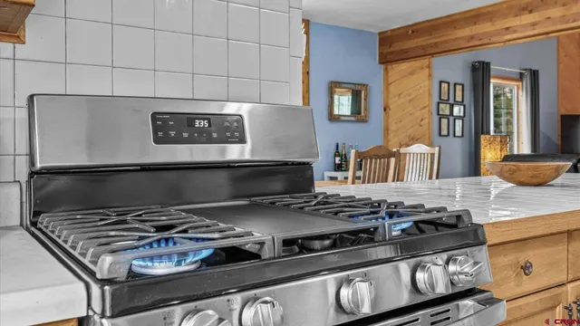 a dining room with furniture and window