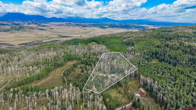 a view of a field with an ocean