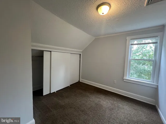 an empty room with a empty space and a window