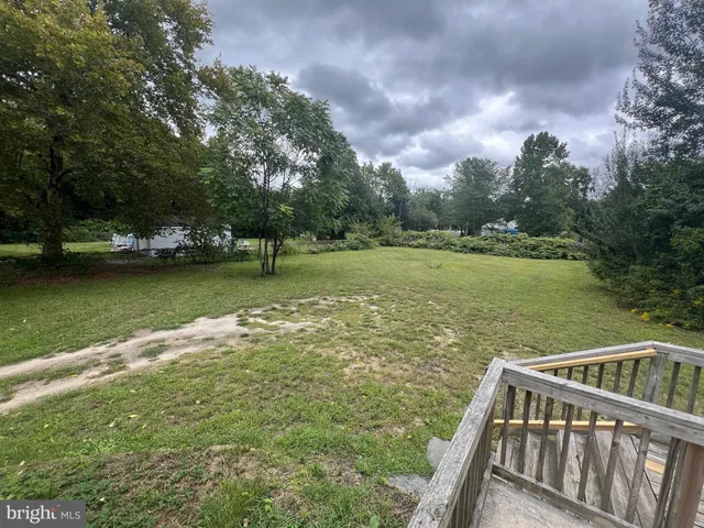 a view of a ocean from a balcony with outdoor space