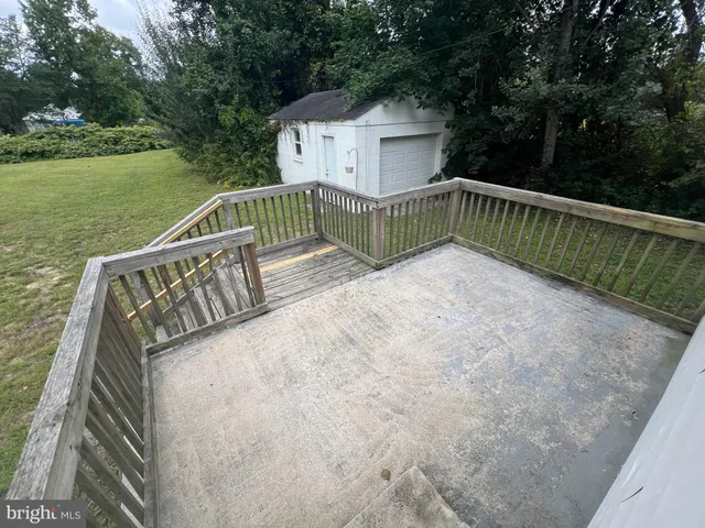 a view of balcony with yard and green space