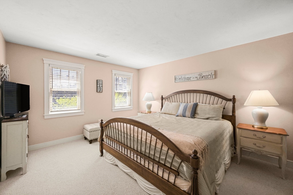11 Whites Ferry Landing Marshfield, MA 02050 - Photo 20 of 42 a bedroom with a bed and a tv on the dresser