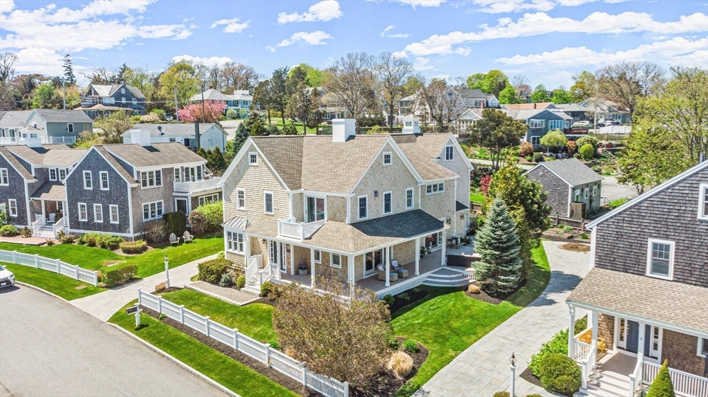 11 Whites Ferry Landing Marshfield, MA 02050 - Photo 2 of 42 a aerial view of a house with a yard table and chairs