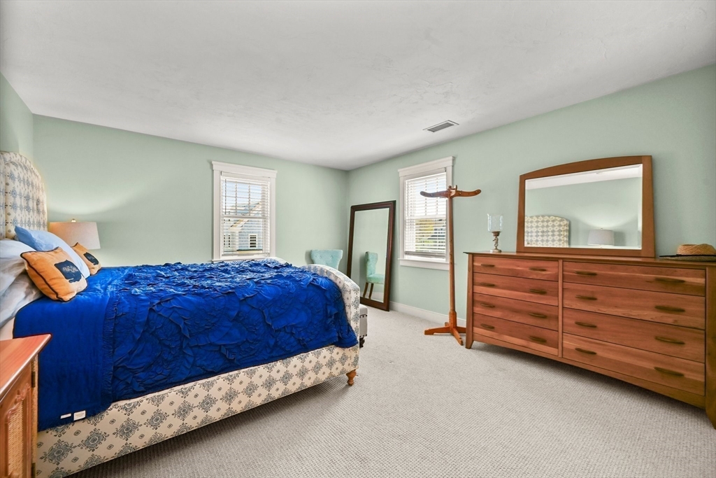 11 Whites Ferry Landing Marshfield, MA 02050 - Photo 22 of 42 a bedroom with a bed and a dresser