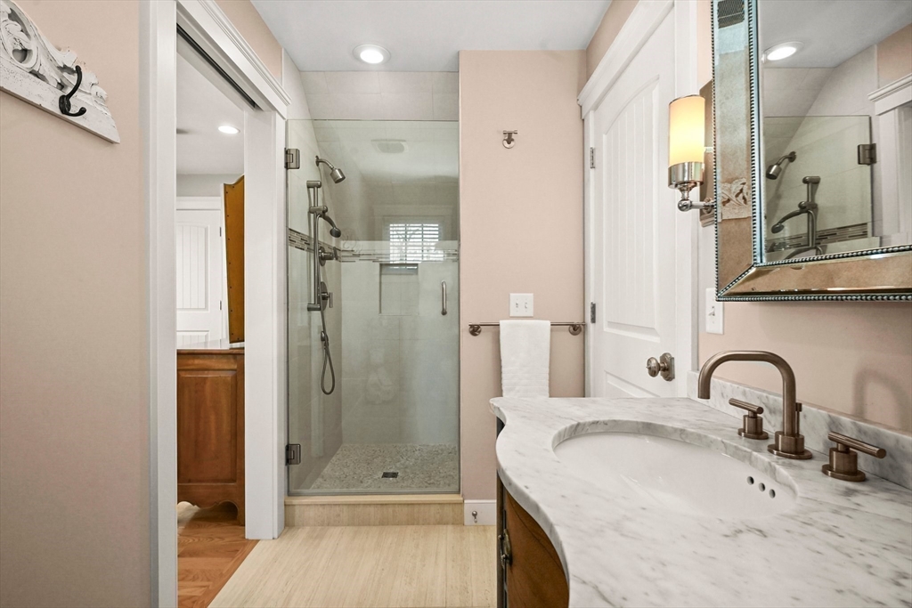 11 Whites Ferry Landing Marshfield, MA 02050 - Photo 23 of 42 a bathroom with a granite countertop sink mirror and shower