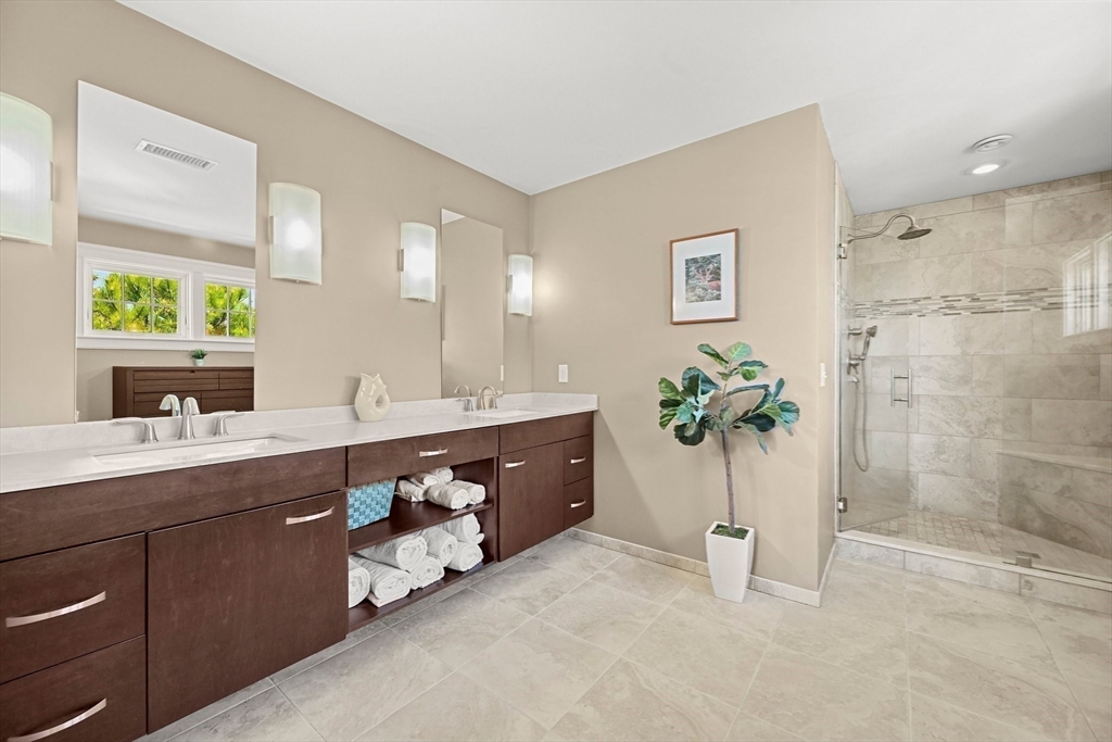 11 Whites Ferry Landing Marshfield, MA 02050 - Photo 30 of 42 a spacious bathroom with a double vanity sink a large mirror a bathtub and shower