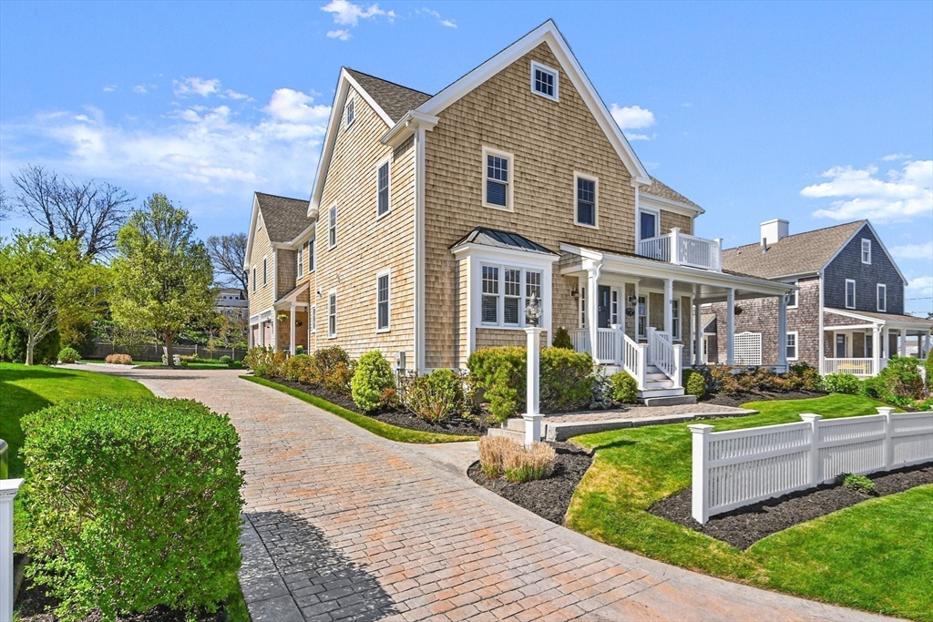 11 Whites Ferry Landing Marshfield, MA 02050 - Photo 3 of 42 a front view of a house with a yard