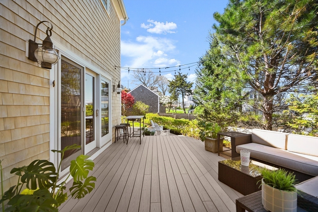 11 Whites Ferry Landing Marshfield, MA 02050 - Photo 34 of 42 a balcony with wooden floor table and chairs