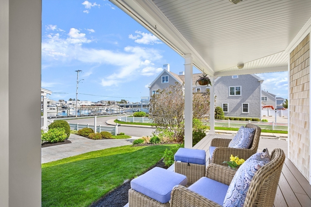 11 Whites Ferry Landing Marshfield, MA 02050 - Photo 35 of 42 a front view of a house with a garden and patio