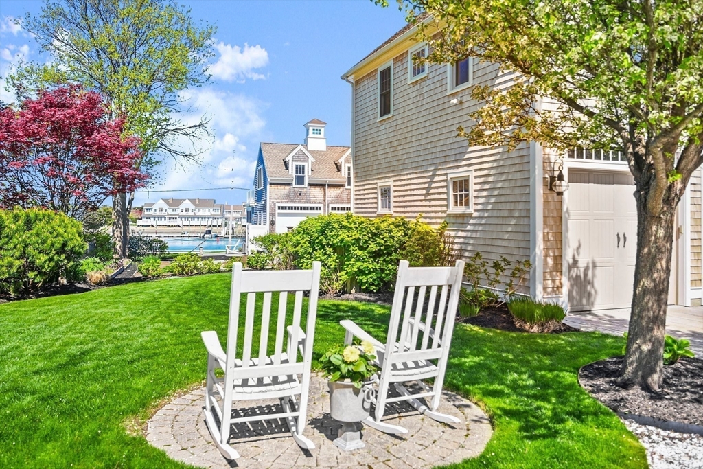 11 Whites Ferry Landing Marshfield, MA 02050 - Photo 6 of 42 a view of a chair and table in backyard of the house