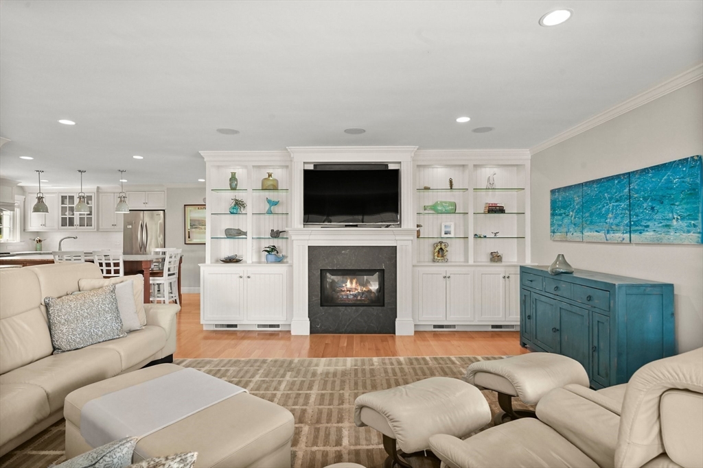11 Whites Ferry Landing Marshfield, MA 02050 - Photo 8 of 42 a living room with furniture a flat screen tv and a fireplace