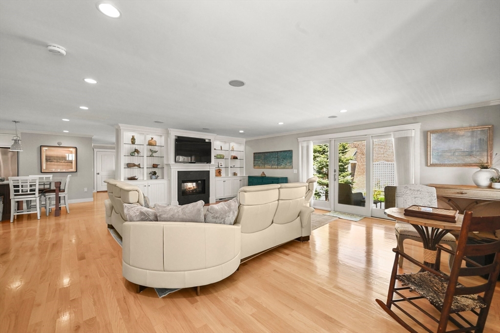 11 Whites Ferry Landing Marshfield, MA 02050 - Photo 9 of 42 a living room with fireplace furniture and a wooden floor