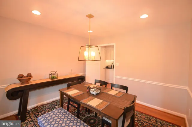 a living room with couches and a flat screen tv